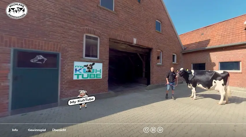 360-Grad-Videotour über einen Bauernhof mit Kühen vor dem Stall